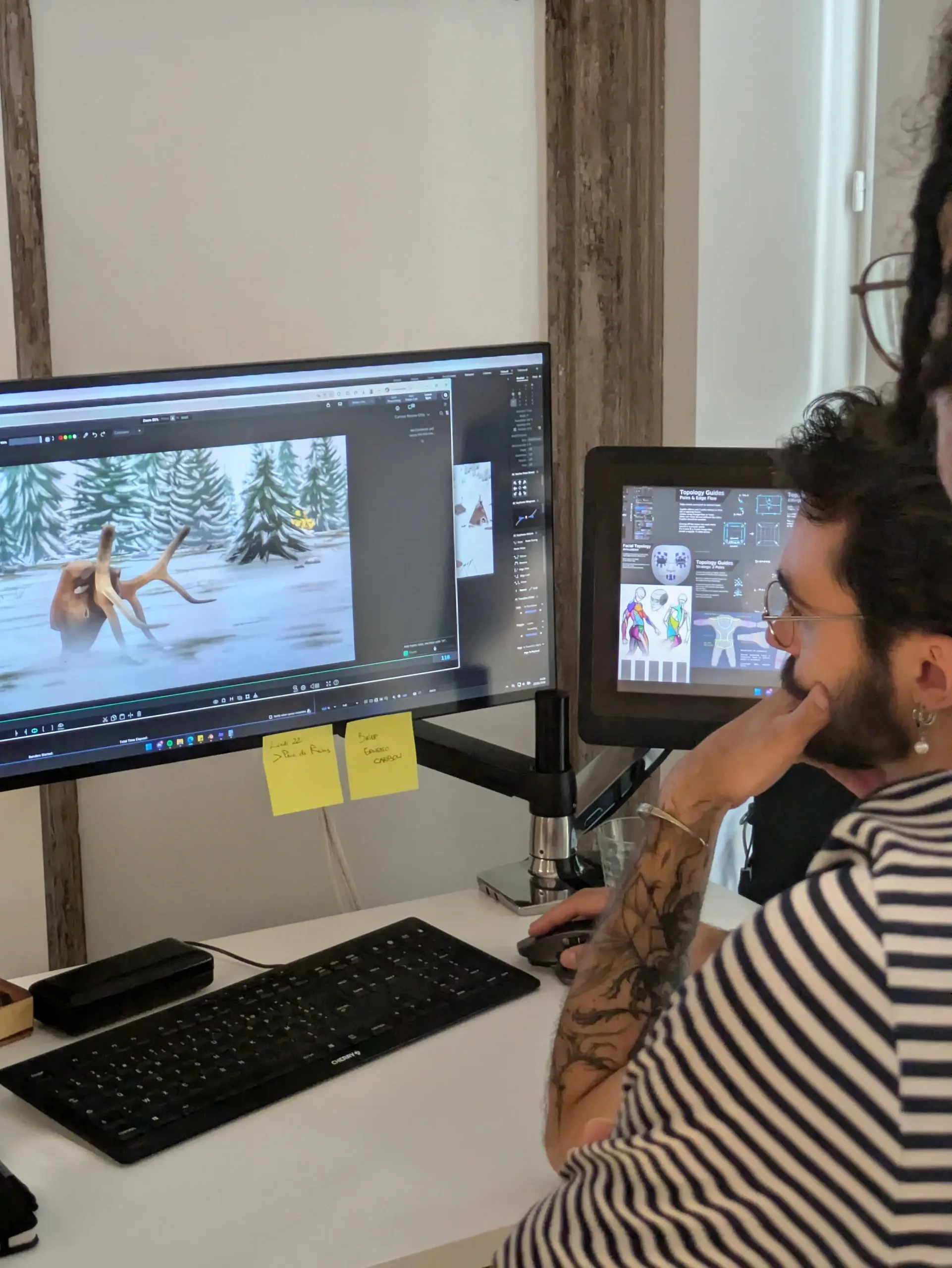 Thibault Dumoulin, animateur 3D du studio Amopix à Strasbourg, travaillant sur une scène de caribou dans la neige parmi des sapins